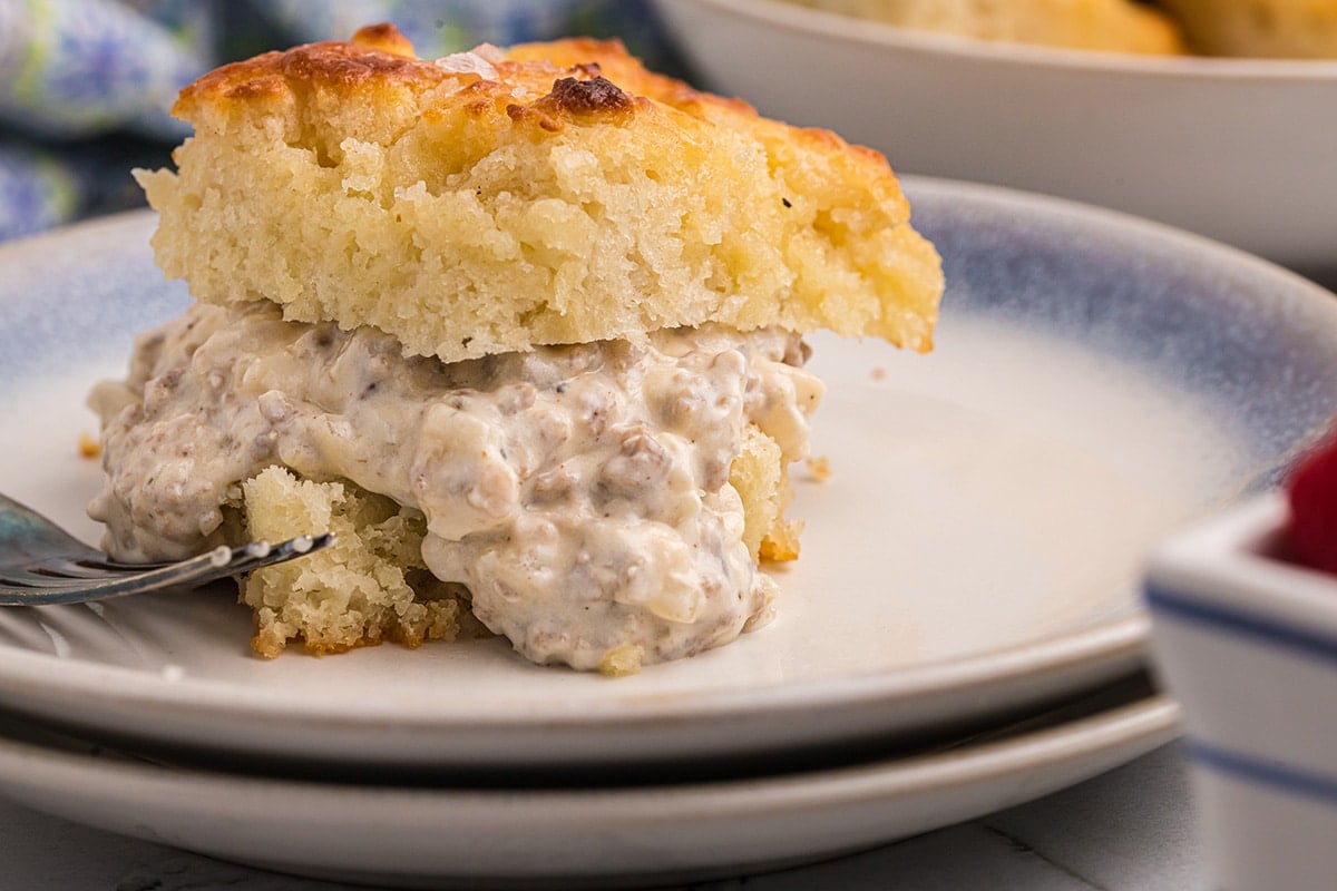 close up of biscuit with sausage gravy