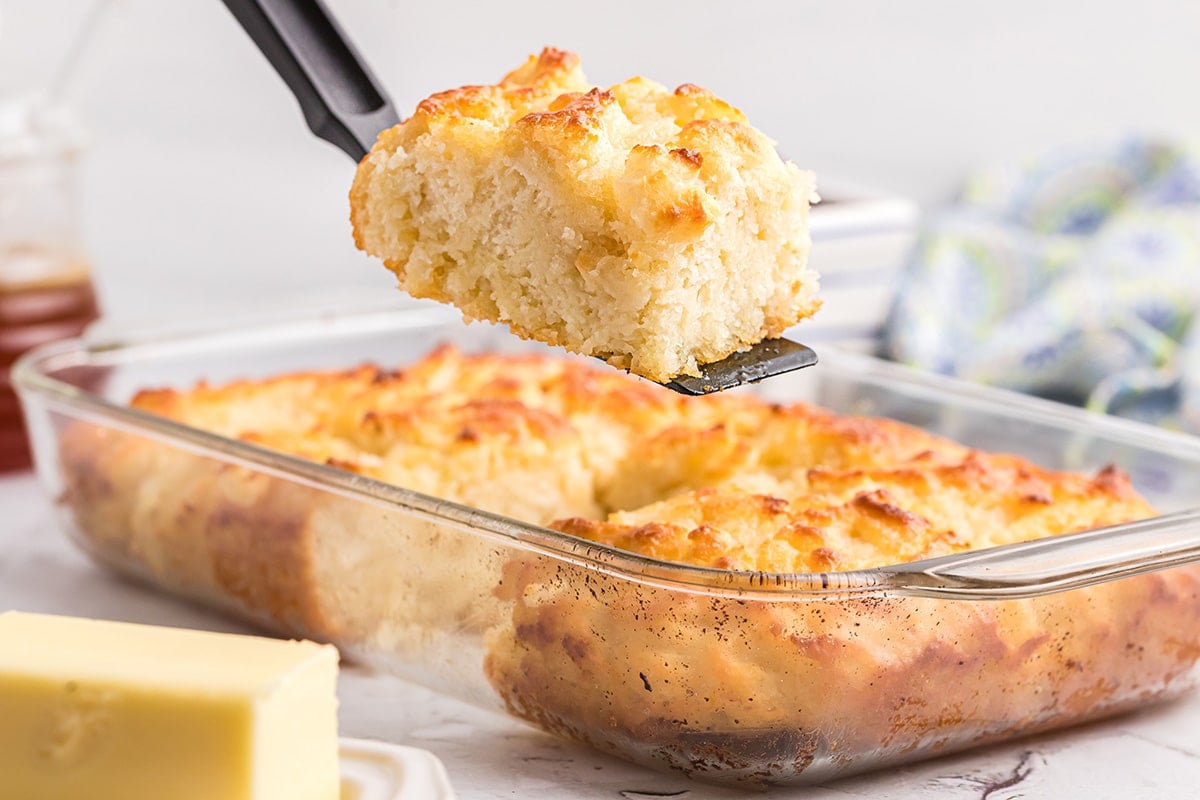 spatula holding a butter swim biscuit