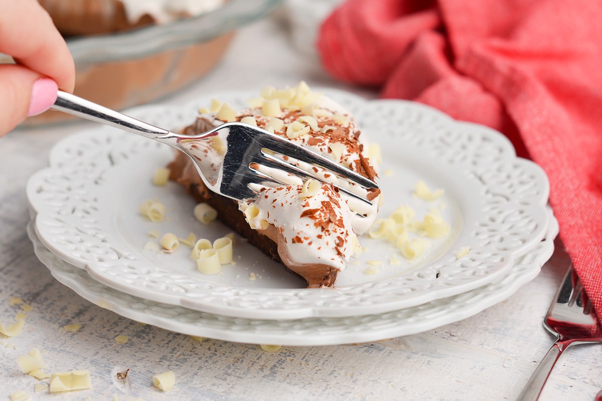 fork digging into a slice of pie