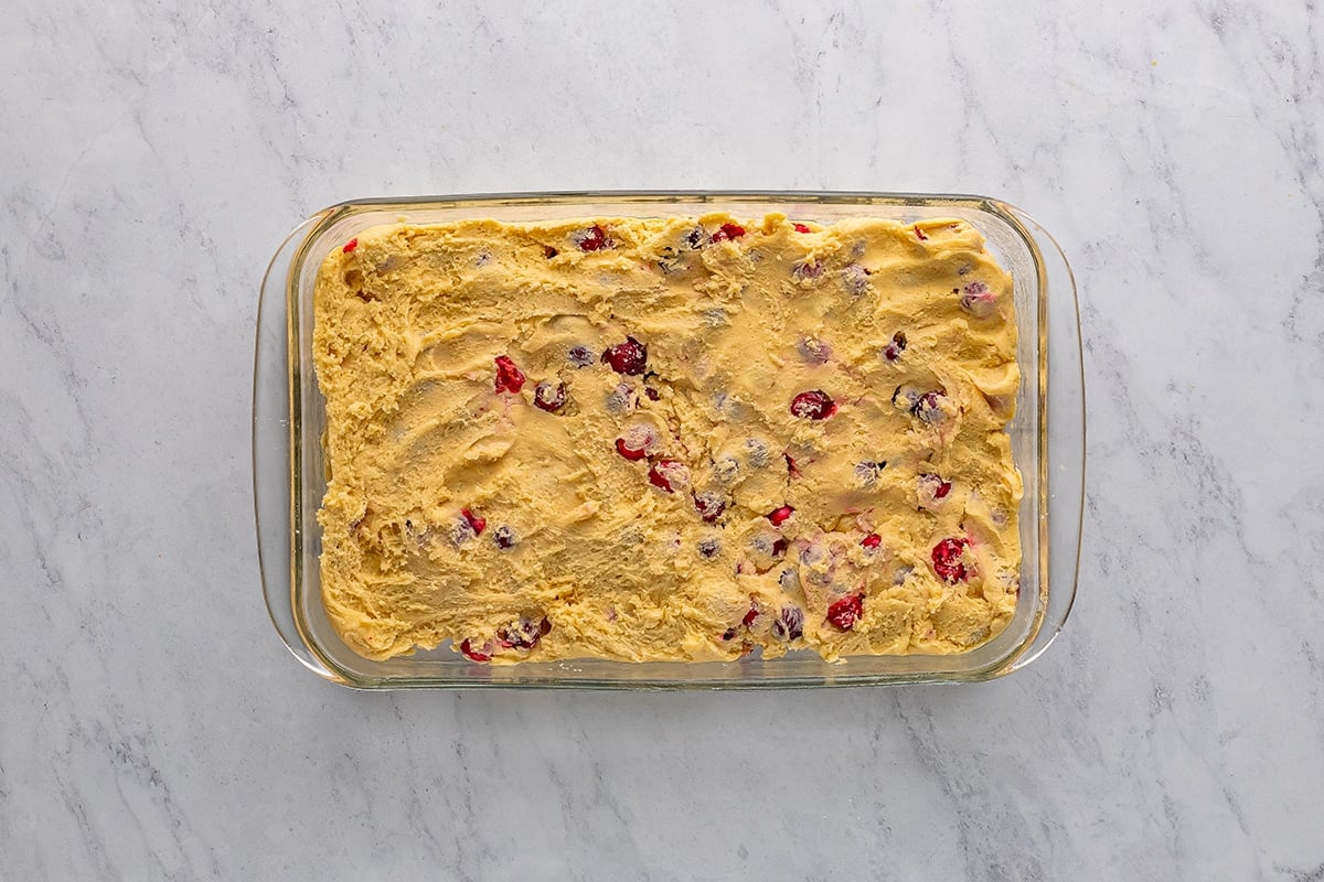 overhead shot of cranberry coffee cake batter in pan