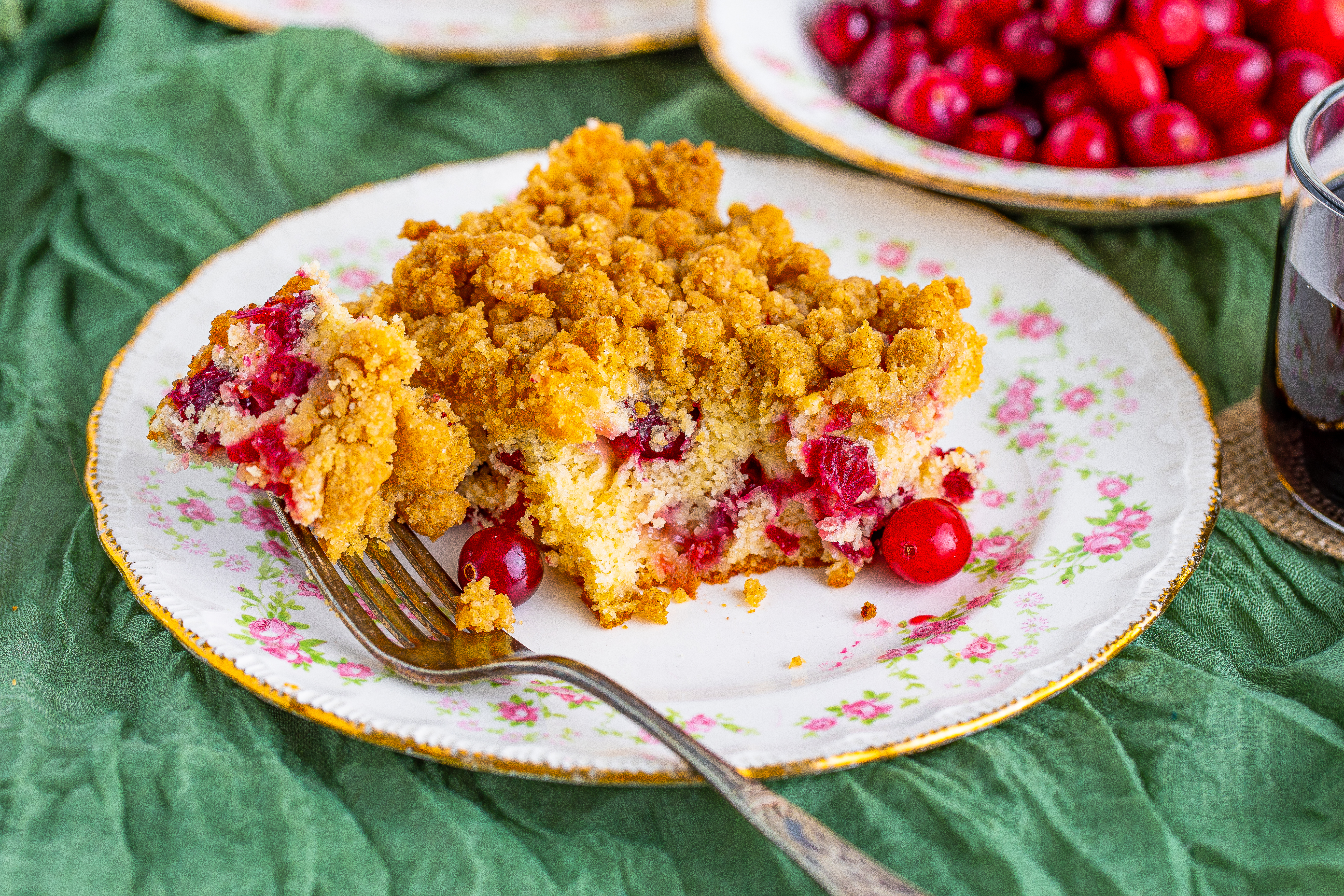 bite taken out of cranberry coffee cake