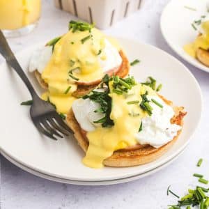 angled shot of eggs benedict on plate