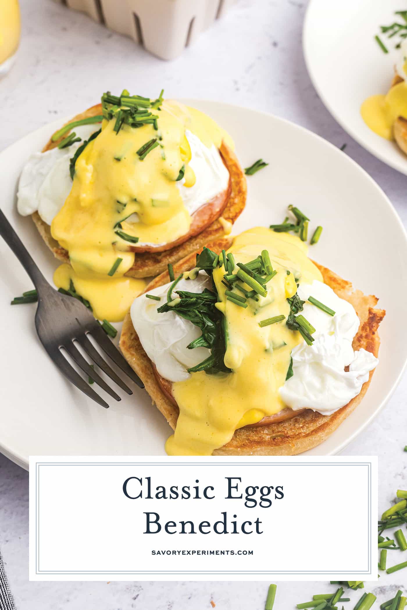 eggs benedict on a plate with text overlay for pinterest