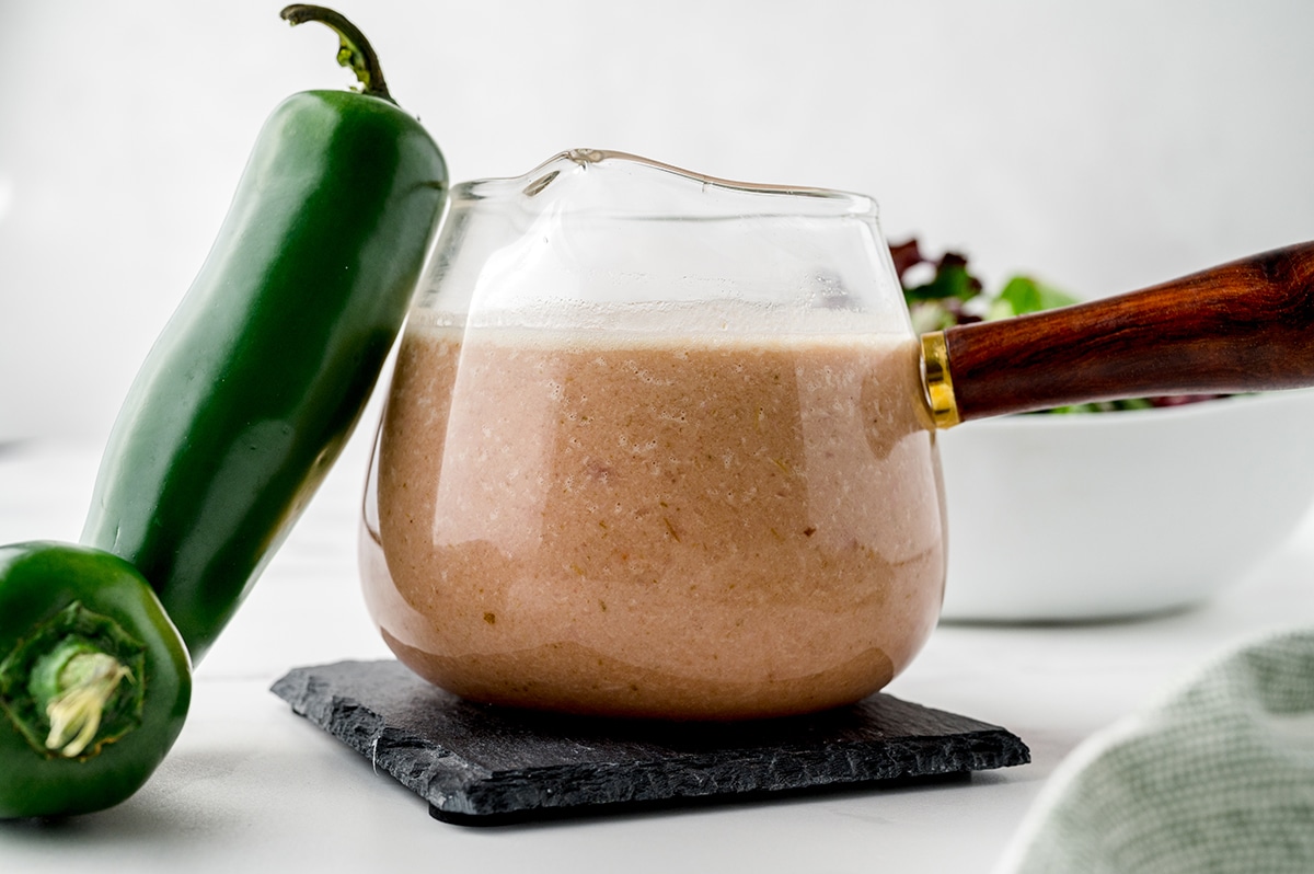 jalapeno leaning on jar of dressing