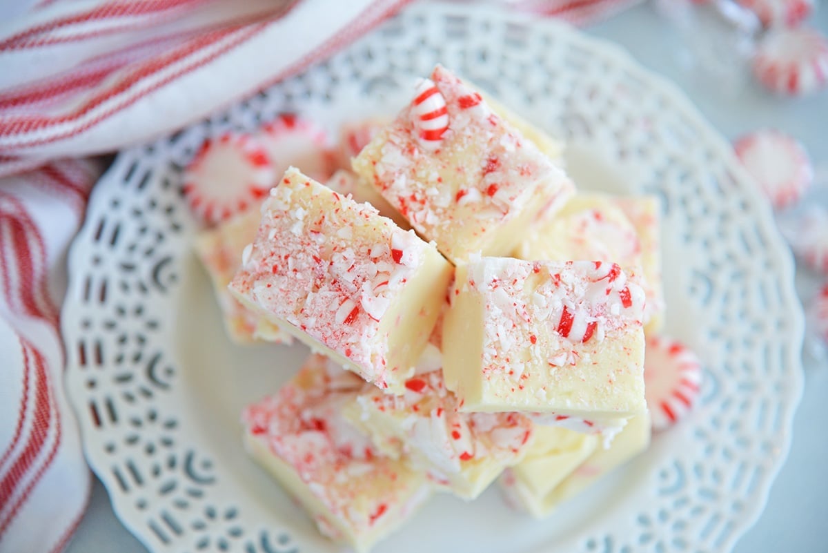 stack of easy peppermint fudge on a white plate