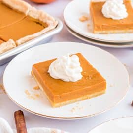 slices of pumpkin pie with whipped cream