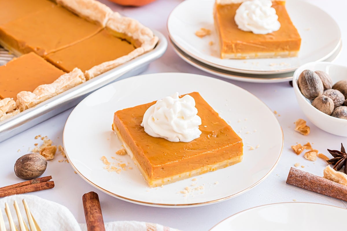 slices of pumpkin pie with whipped cream