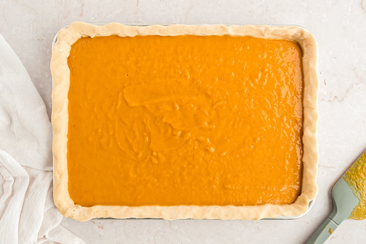 pumpkin pie filling in a crust in a 9x13 pan