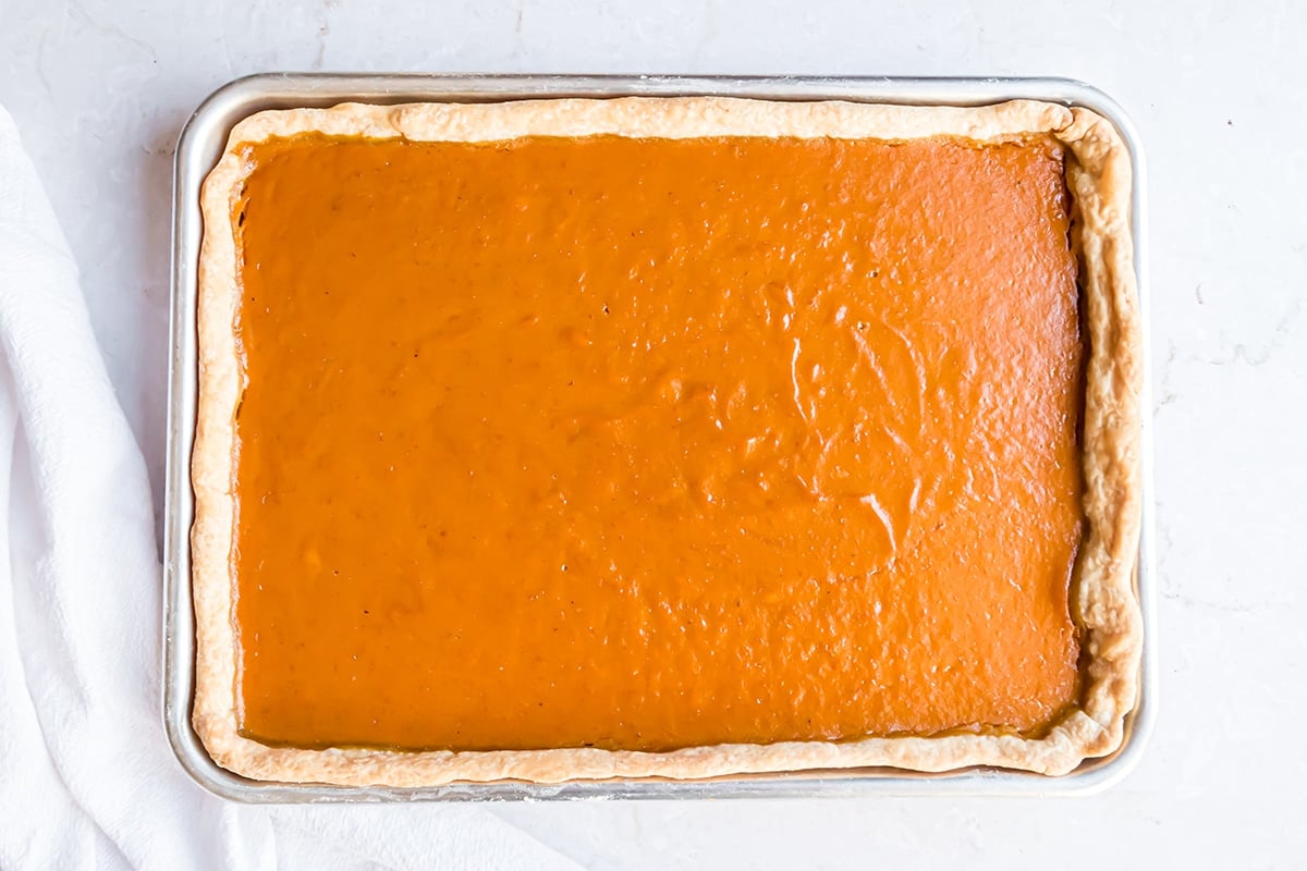 cooked pumpkin pie in a 9x13 dish