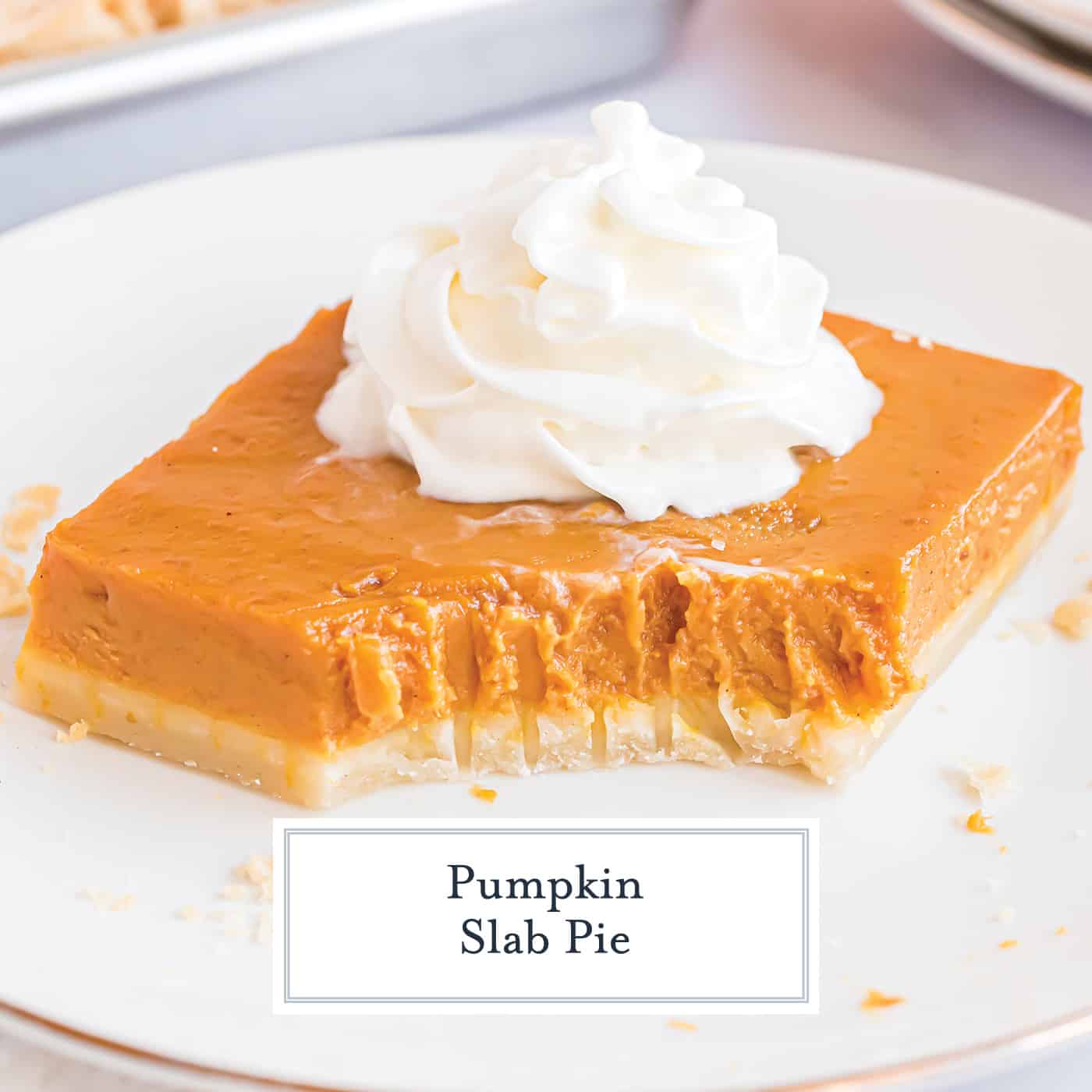 pumpkin slab pie with a bite taken out on a plate
