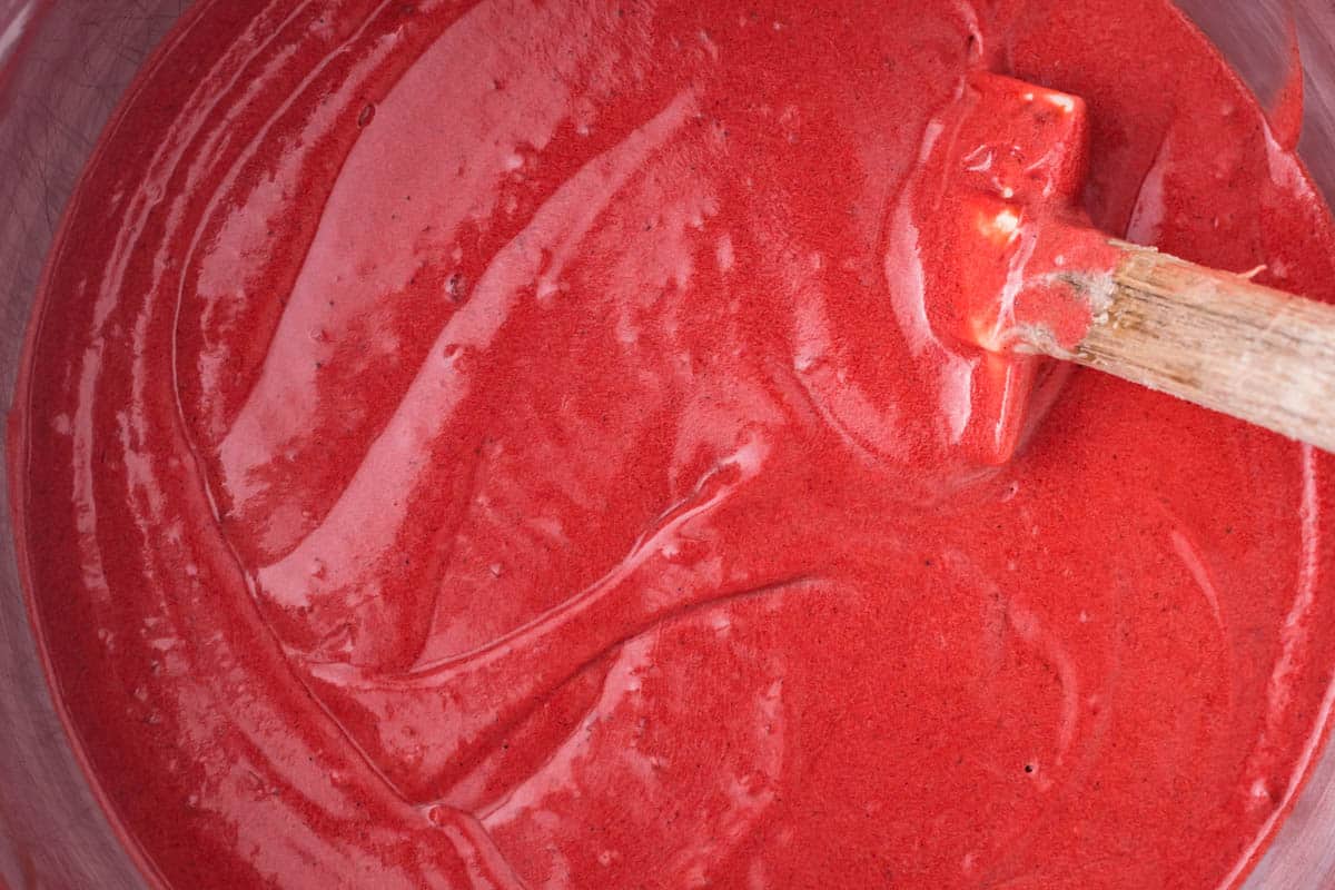 spatula stirring red velvet cake batter