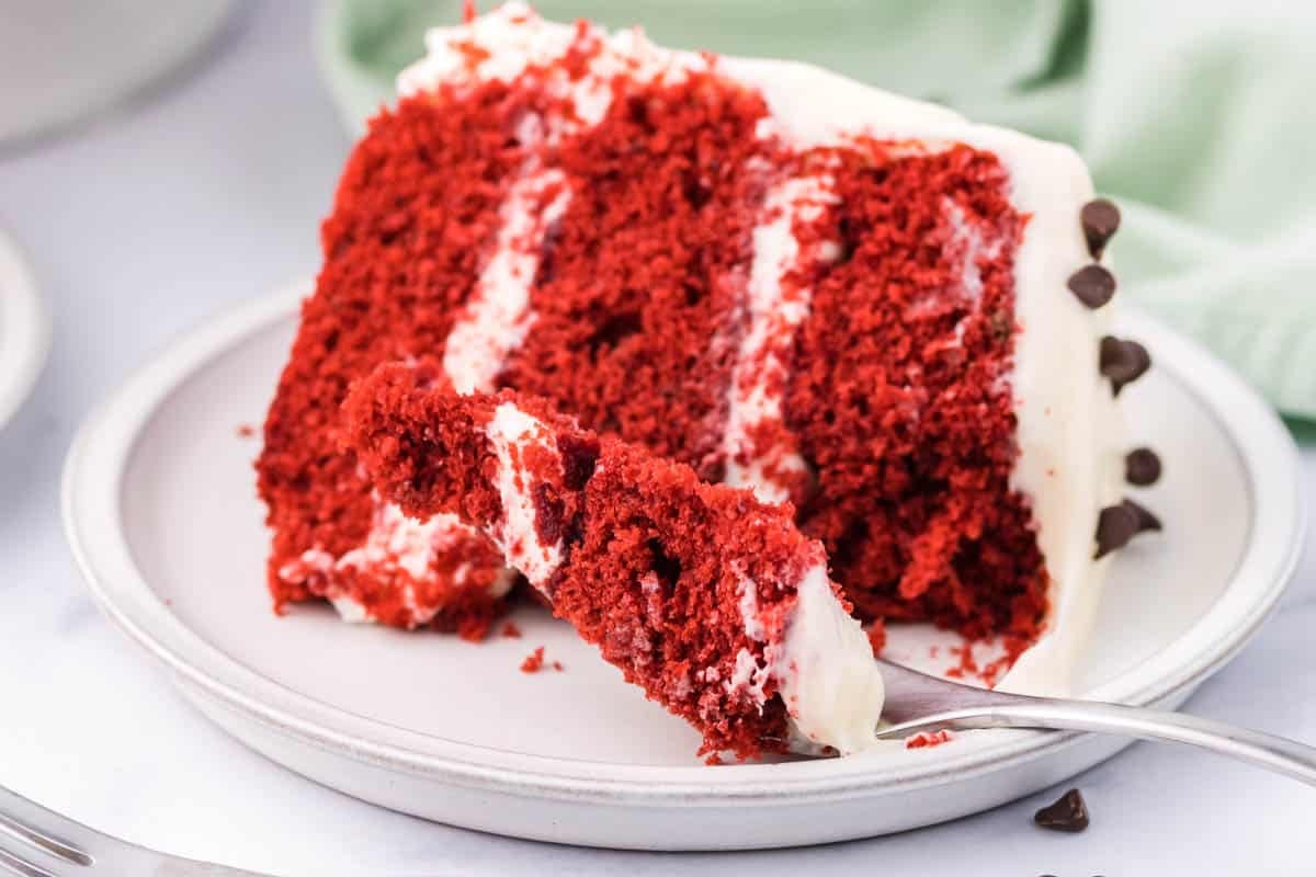 fork with bite of red velvet cake