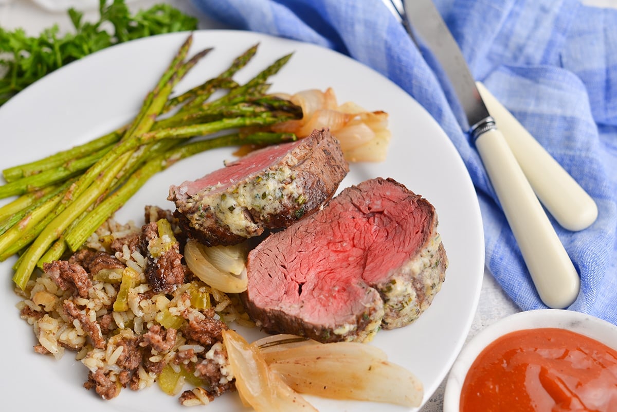 two slices of roast beef tenderloin on plate