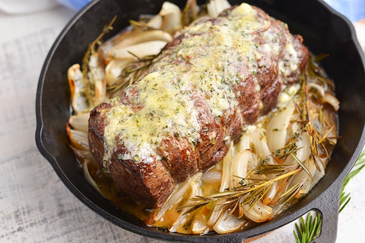 roast beef tenderloin on onions in skillet