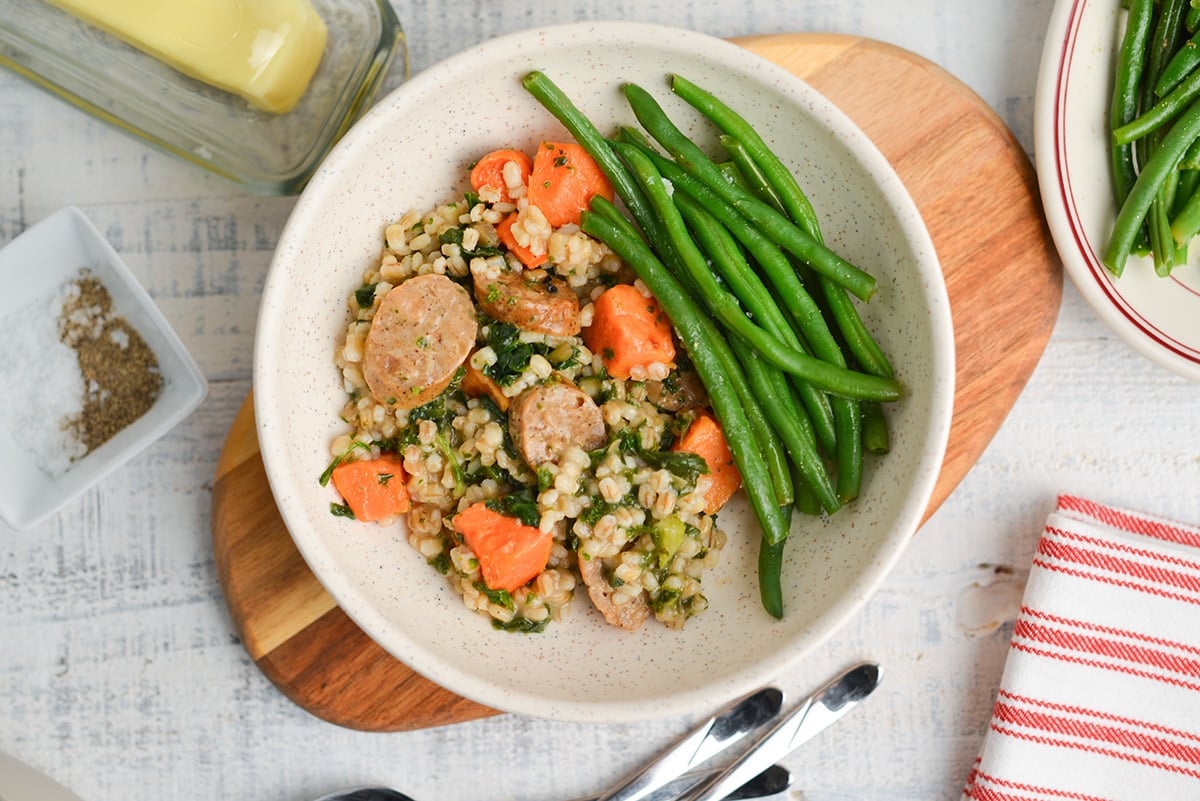 steamed green beans on a dinner plate with stew