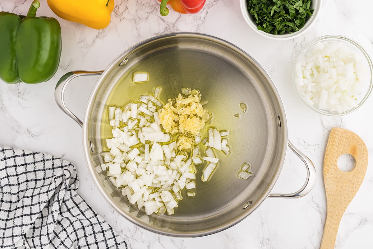 sauteing garlic and onion in a frying pan