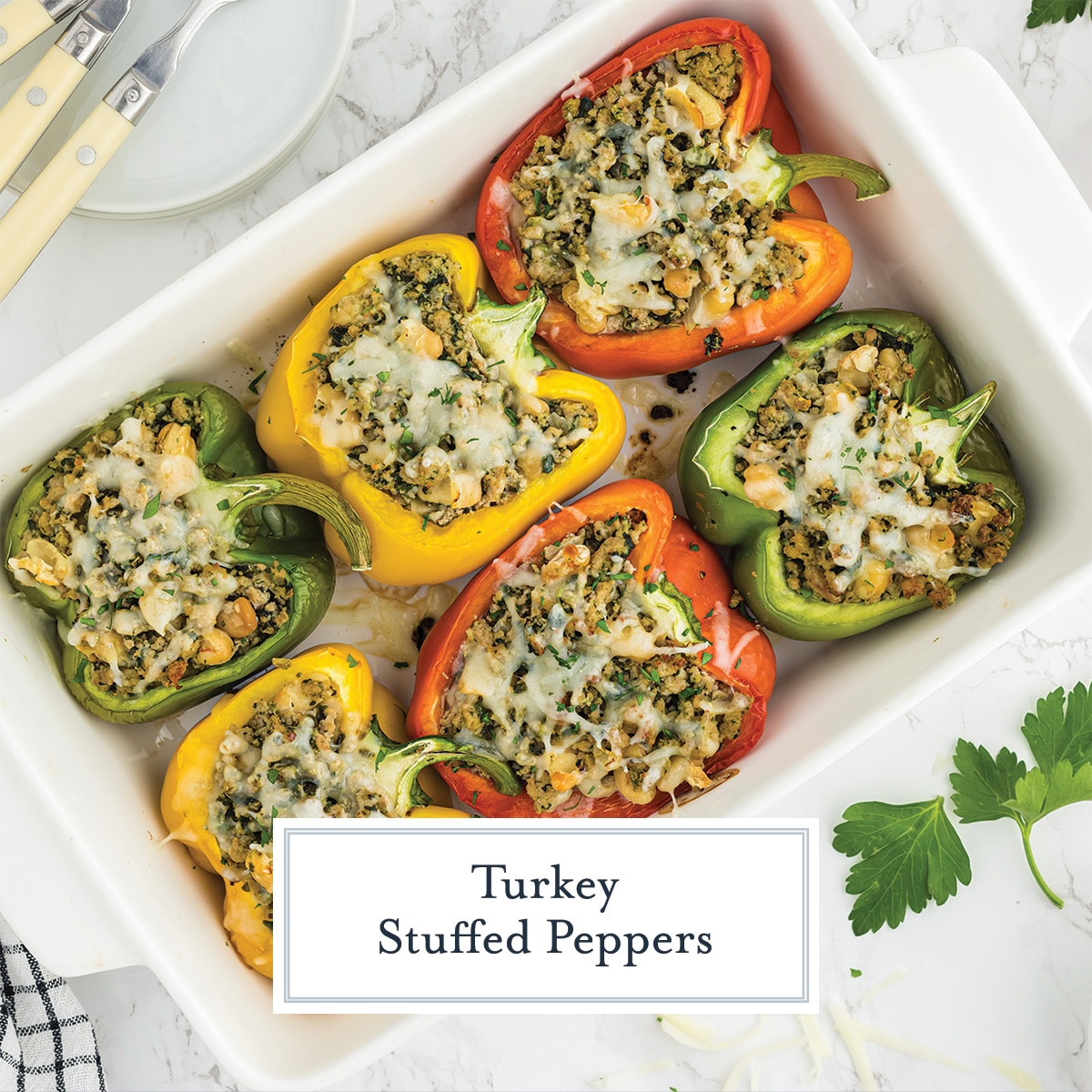 turkey stuffed peppers in a white casserole dish