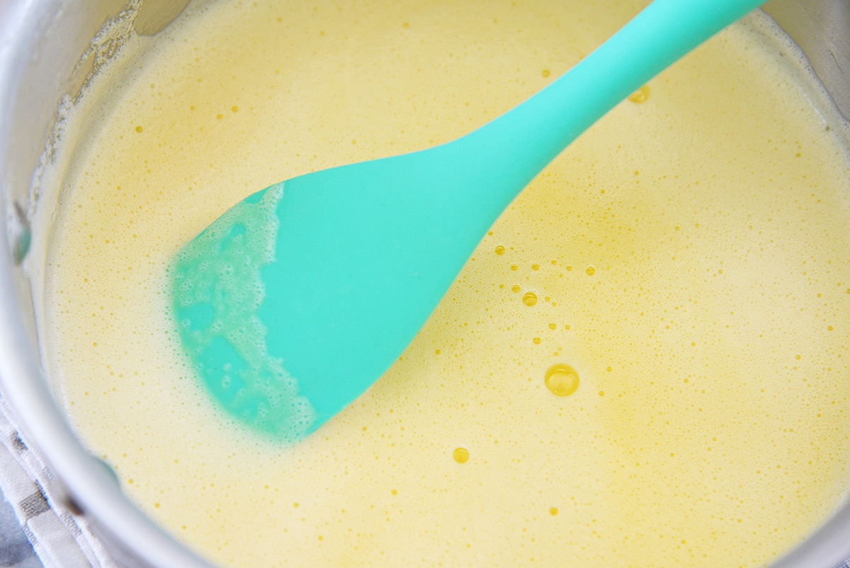 stirring custard on stovetop