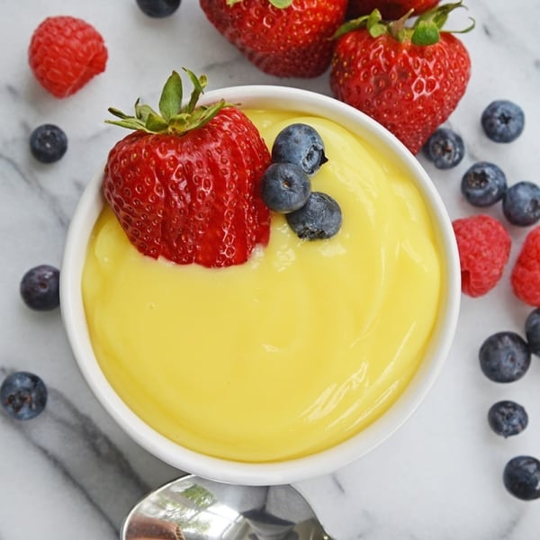 overhead ramekin of vanilla custard with fresh berries