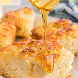 honey drizzling over butter swim biscuits