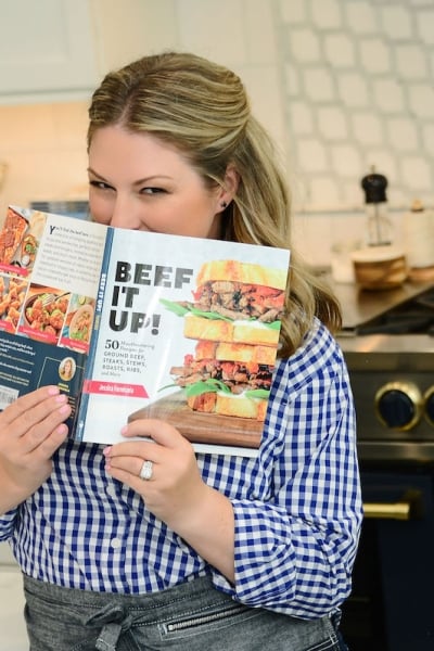 Jessica Formicola holding her cookbook Beef It Up!