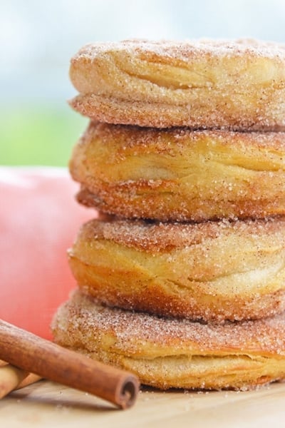 stack of cinnamon sugar donuts with pink linen