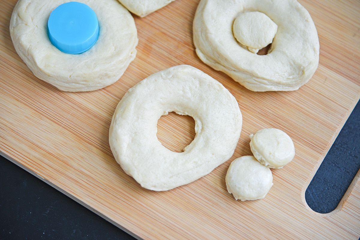 donuts and donut holes on a wood cutting board