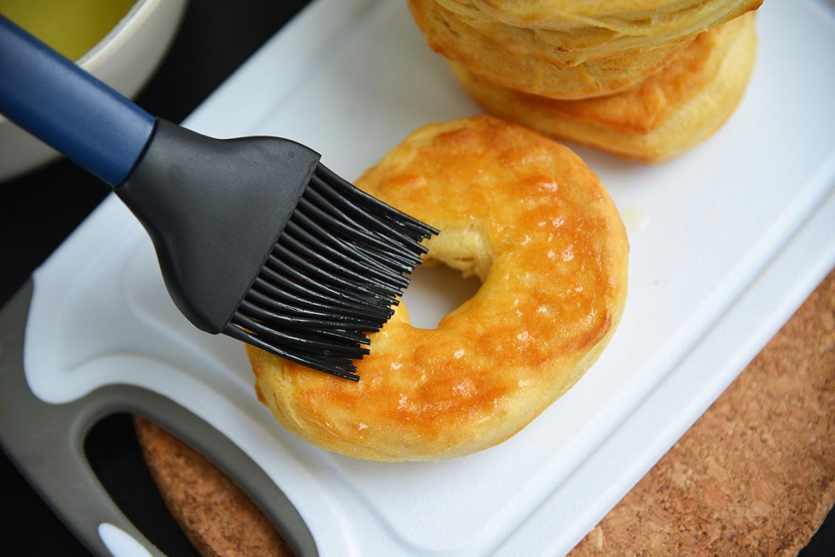 basting a donut with butter