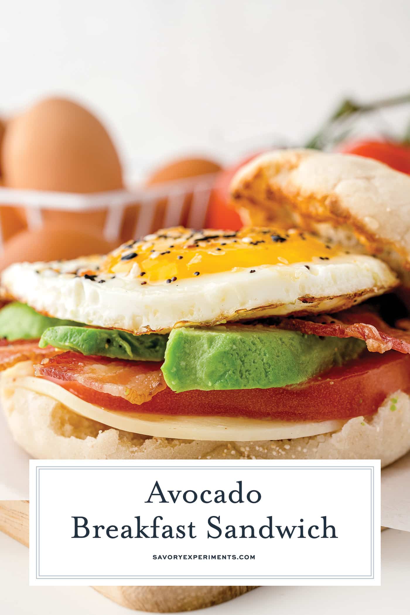 straight on shot of avocado breakfast sandwich with text overlay for pinterest