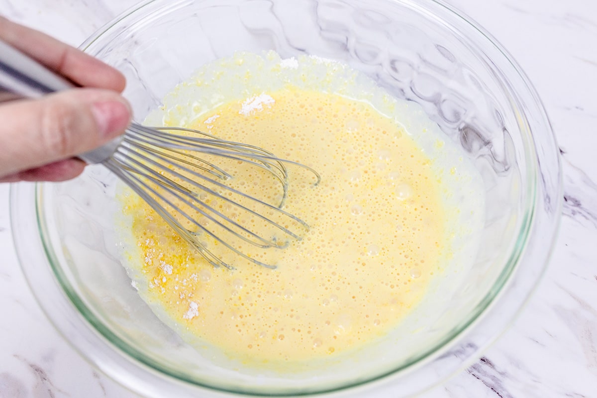 whisking eggnog with pudding mix