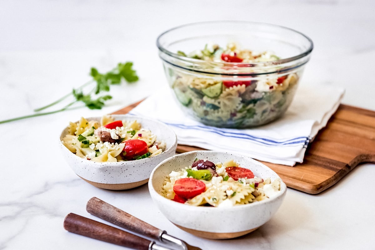 two bowls of pasta salad 