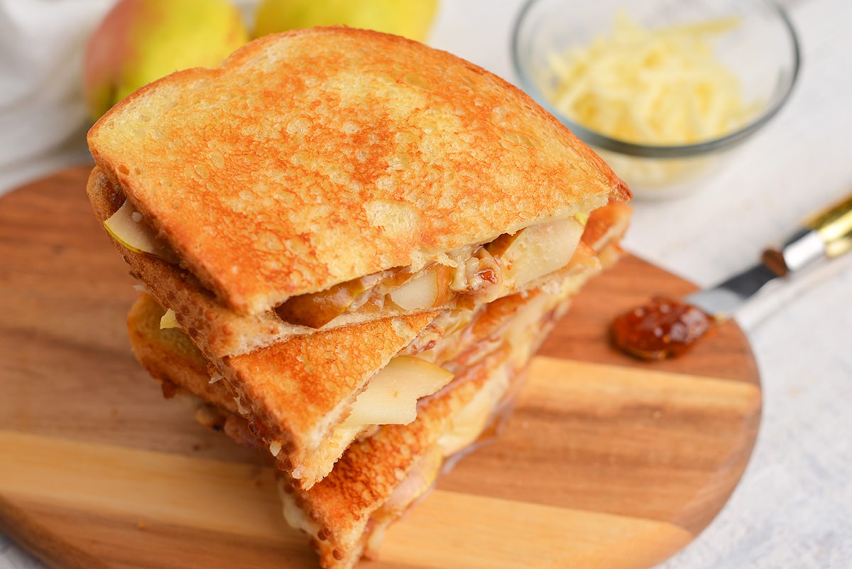 overhead of grilled cheese sandwich on cutting board