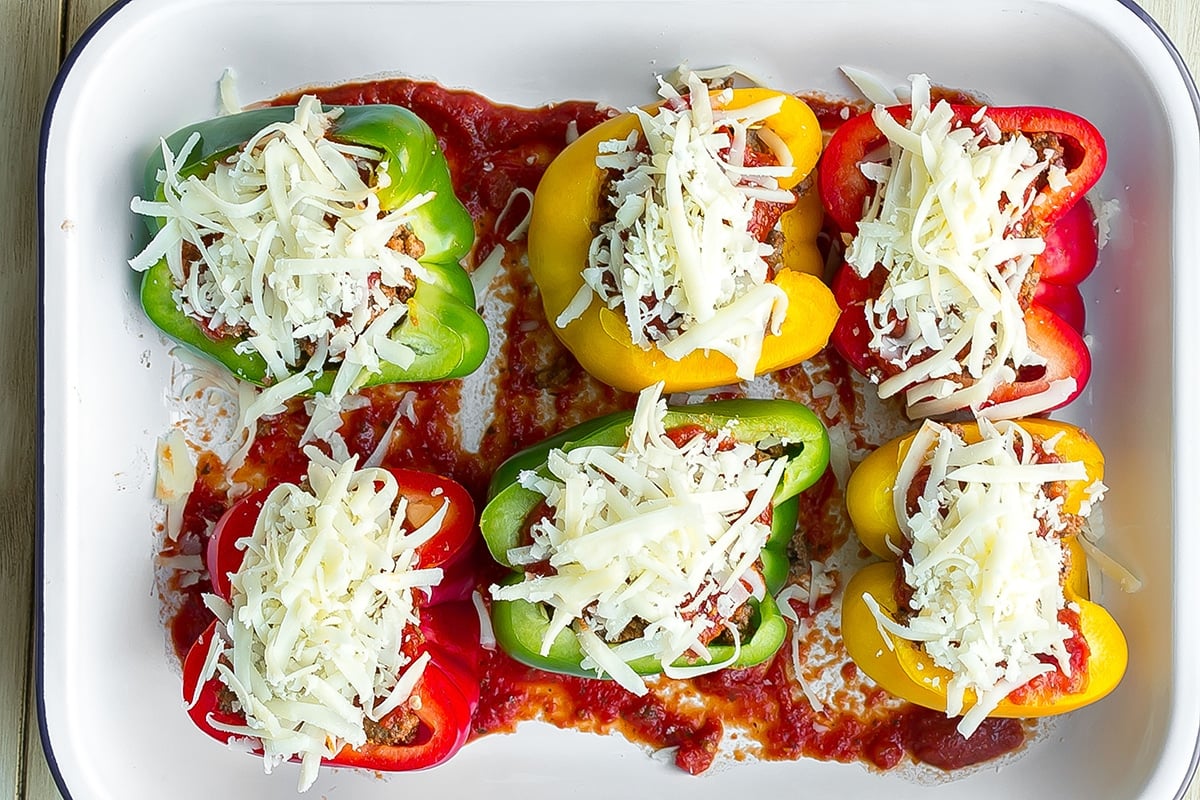 cheese sprinkled on stuffed peppers