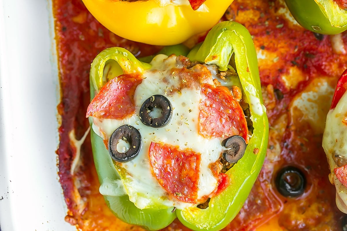 overhead shot of green pepper stuffed with pizza toppings