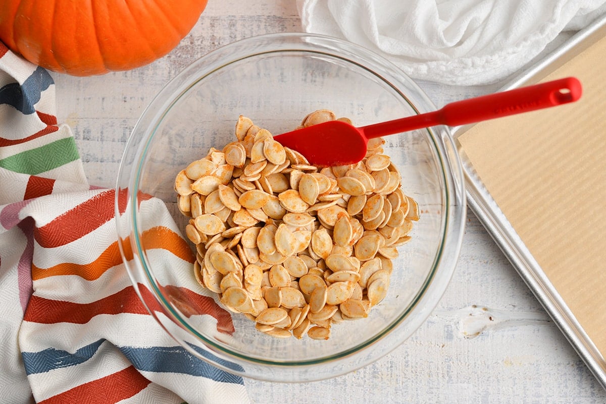 Pumpkins seeds in a glass mixing bowl