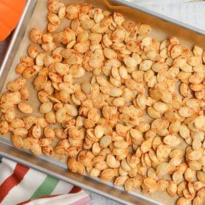 roasted pumpkin seeds on a baking sheet