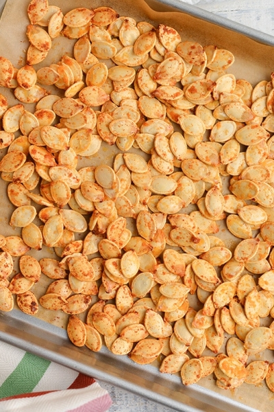 roasted pumpkin seeds on a baking sheet