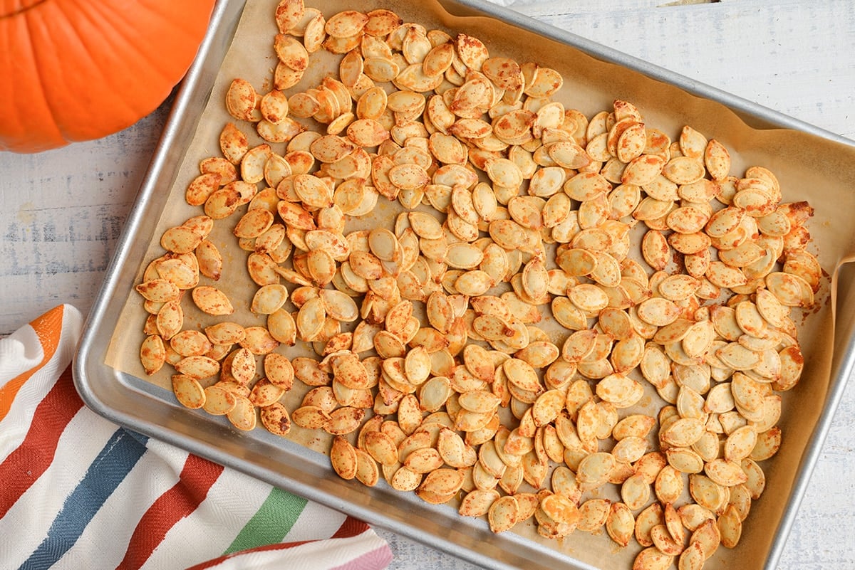 roasted pumpkin seeds on a baking sheet