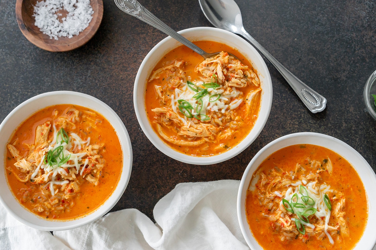 overhead shot of three bowls of soup