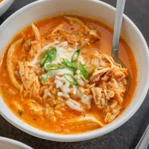 close up of roasted red pepper soup in a bowl