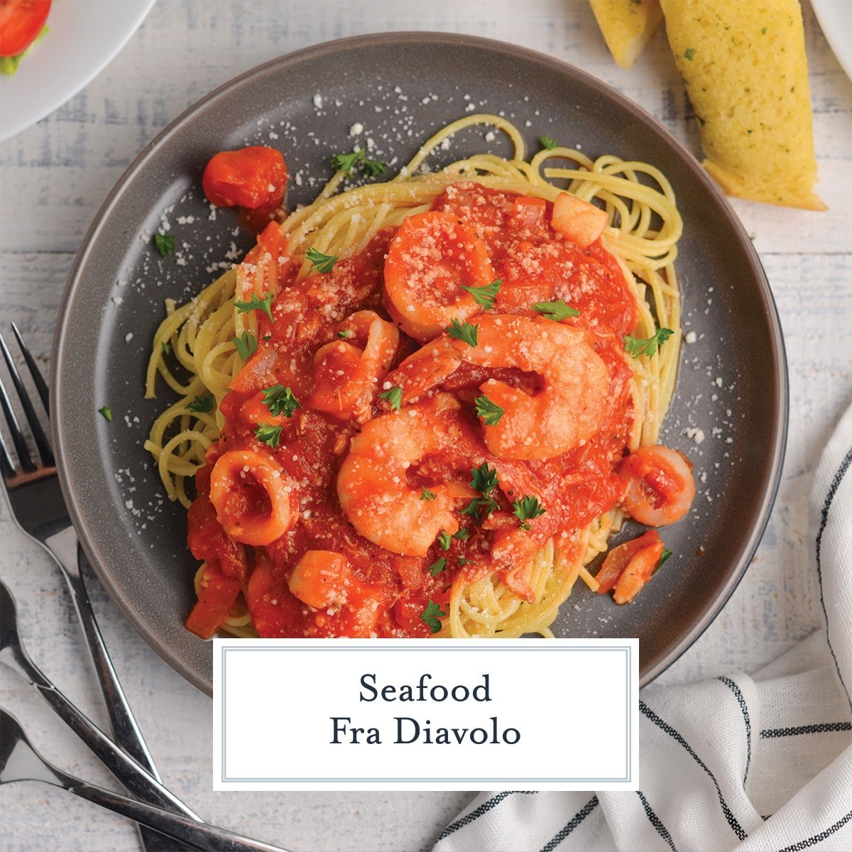seafood fra diavolo on pasta with text overlay