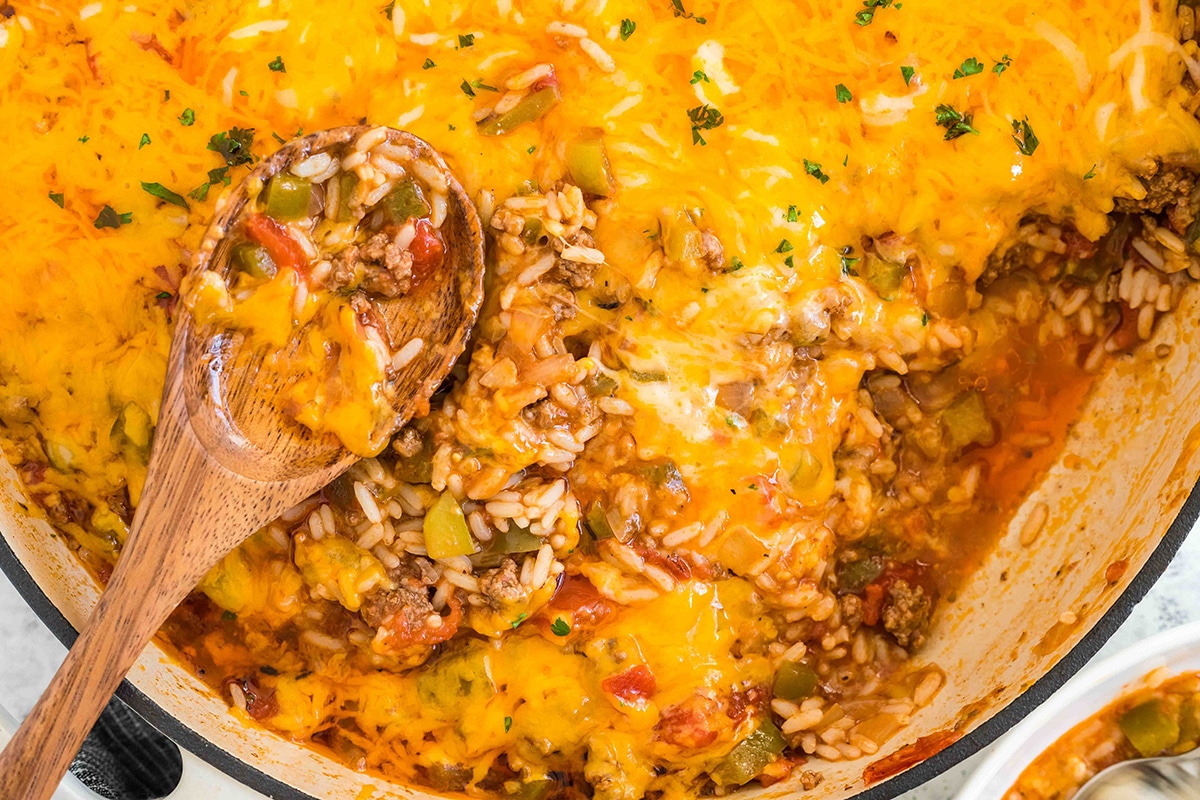 stuffed pepper casserole with wooden spoon in pan