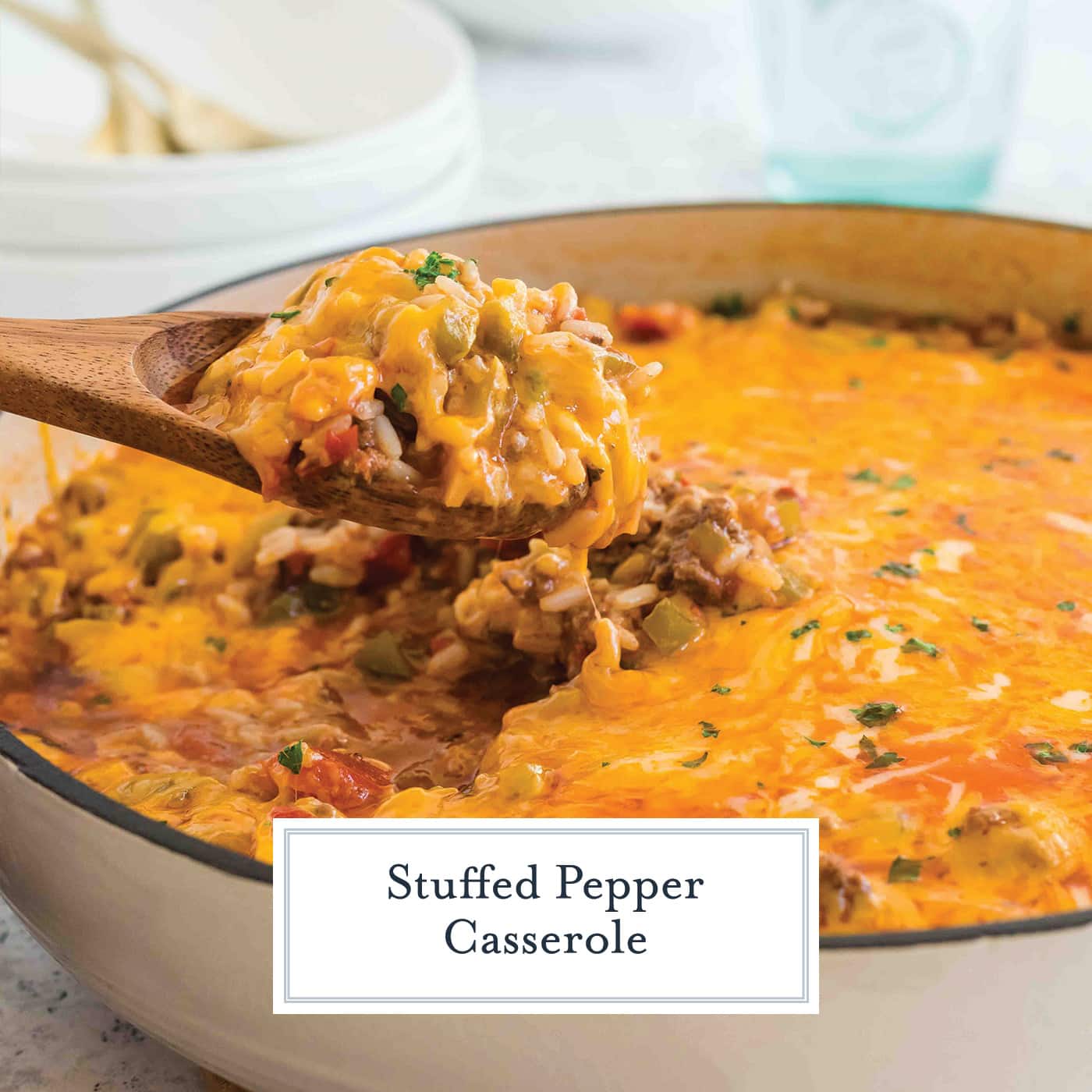 wooden spoon digging into stuffed pepper casserole with text overlay for facebook