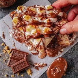 hand grabbing s'mores quesadilla