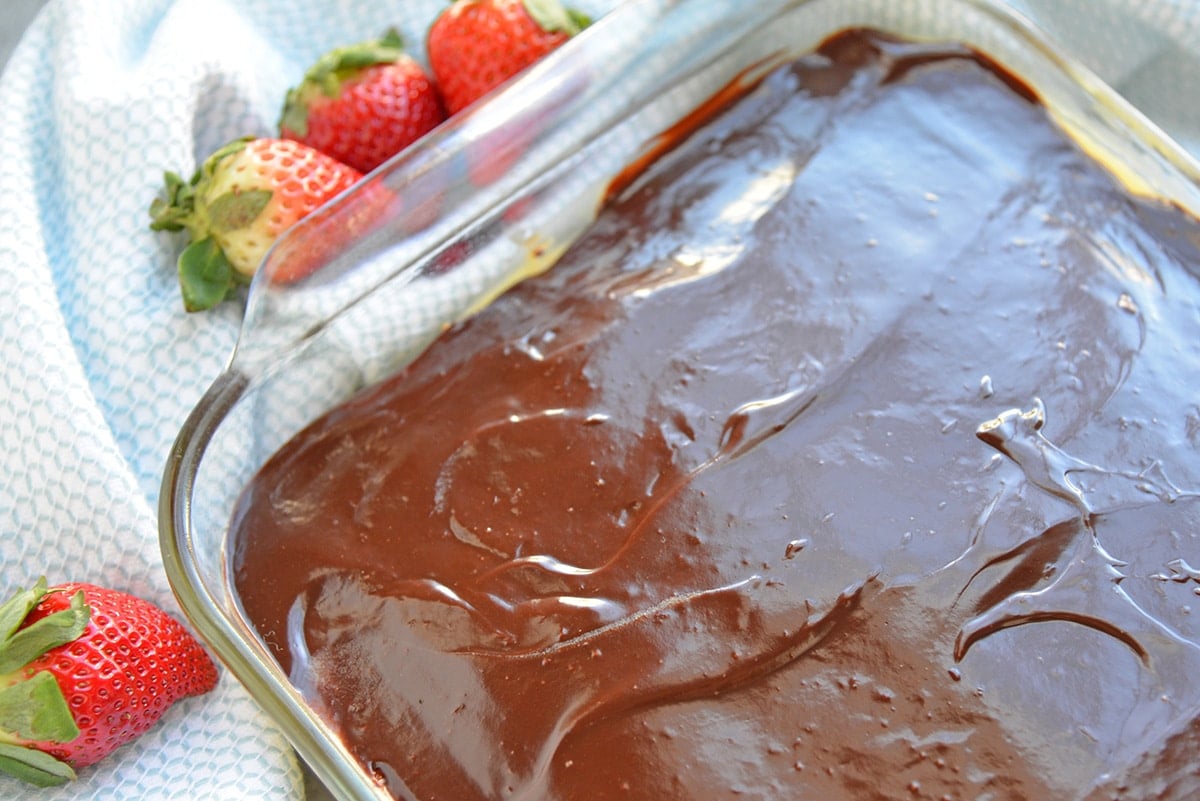 Overhead of frosted Boston Cream Poke Cake