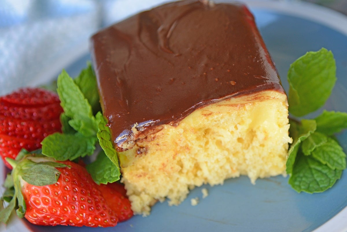 Angle slice of Boston Cream Poke cake