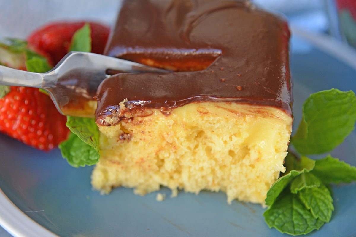 Fork cutting into Boston Cream Cake