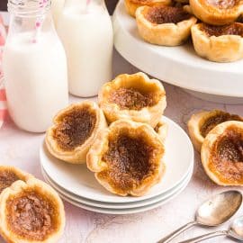 three butter tarts on a plate