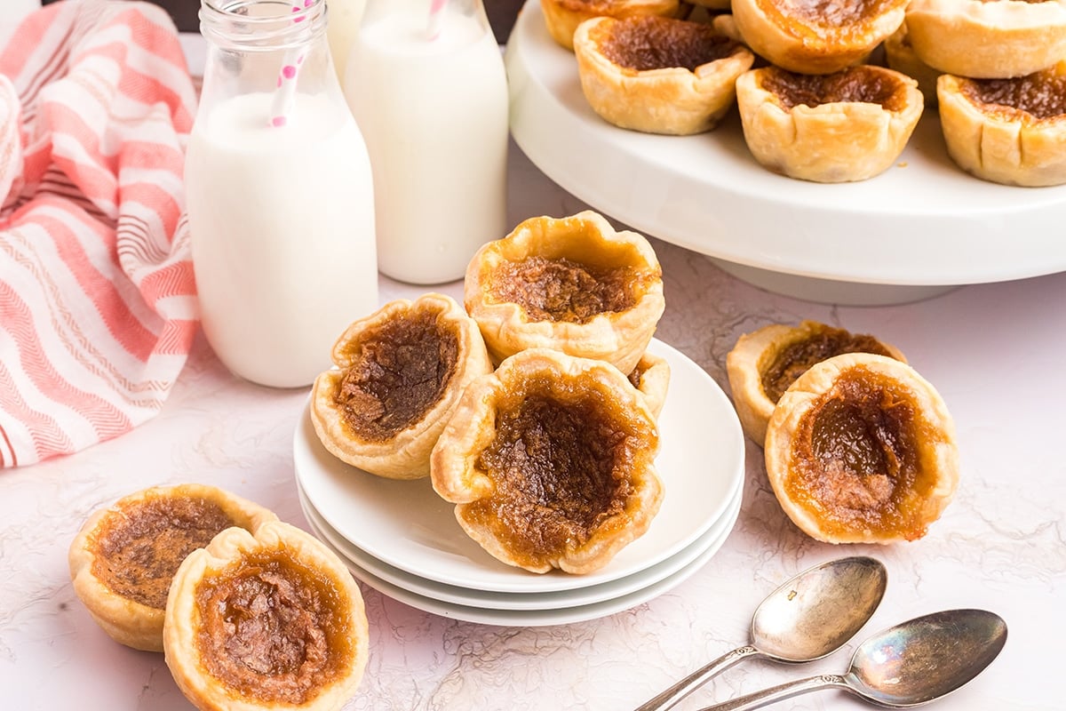 three butter tarts on a plate