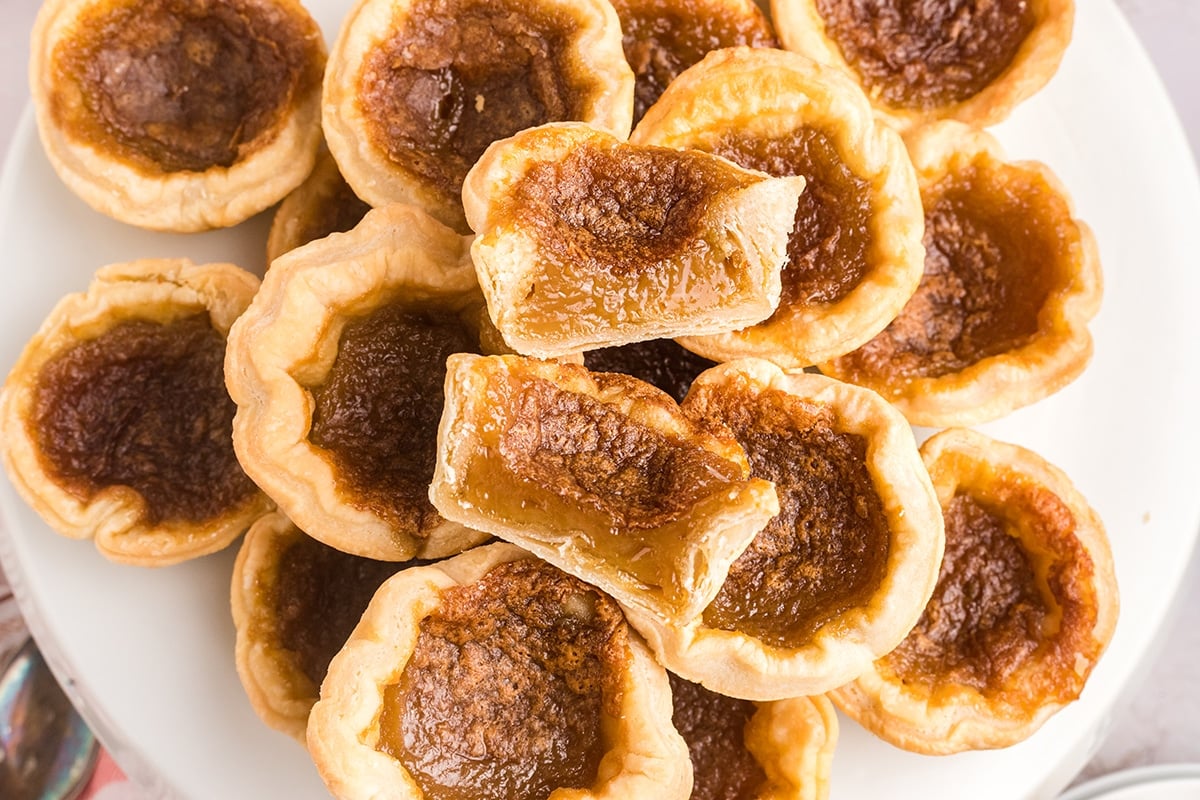 overhead shot of pile of butter tarts cut in half